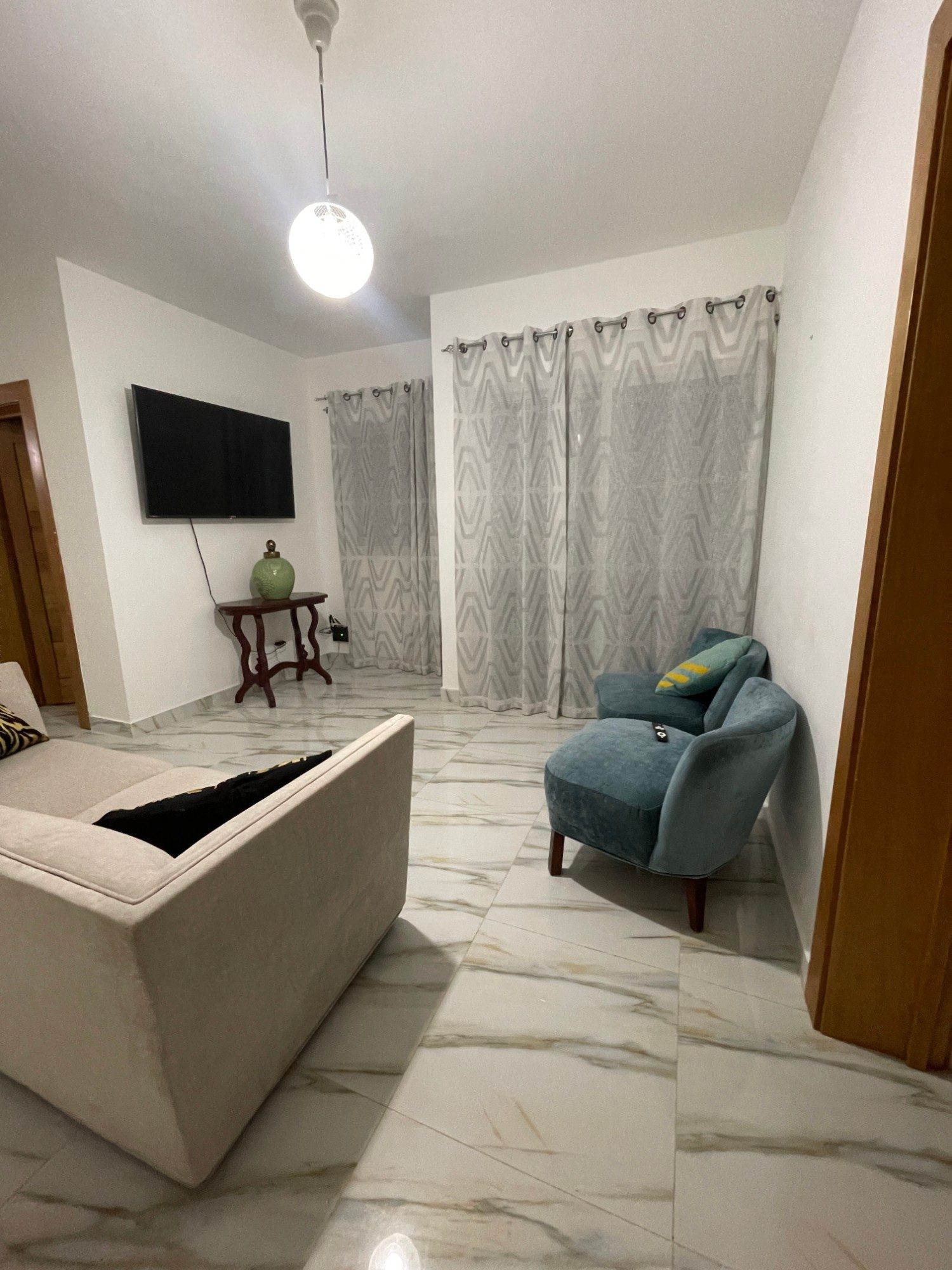The living room in the evening, looking towards the terrace